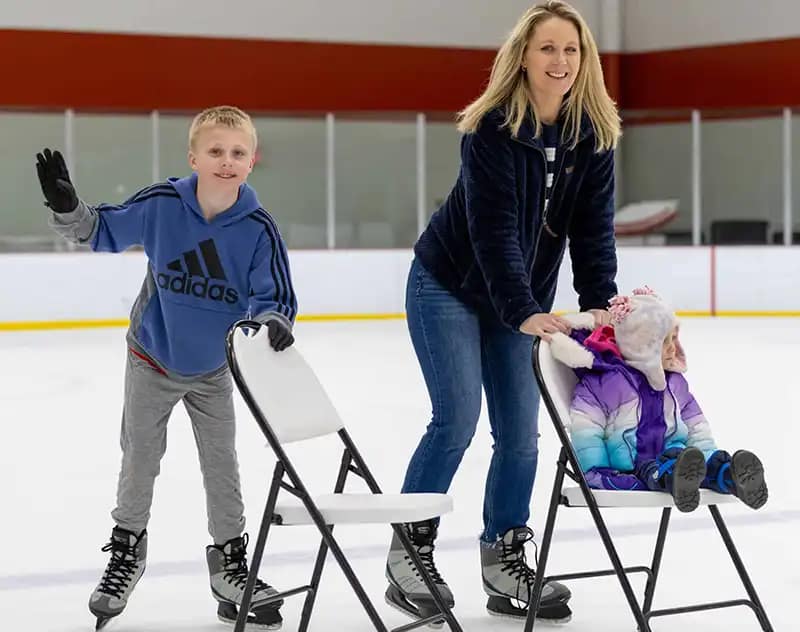Woman Skating With Her Children